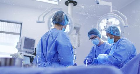 Female surgical team performing complex operation in modern operating room