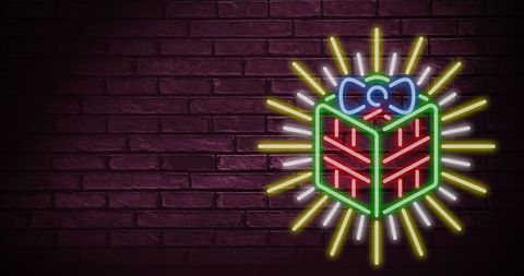 Neon Christmas Gift on Brick Wall Perfect Festive Celebration