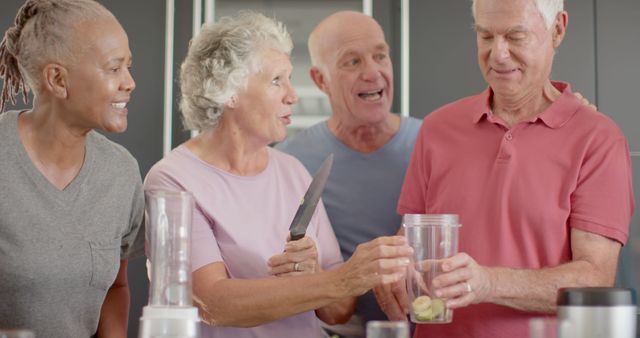 Group of Senior Friends Enjoying Cooking Together in Modern Kitchen - Download Free Stock Images Pikwizard.com