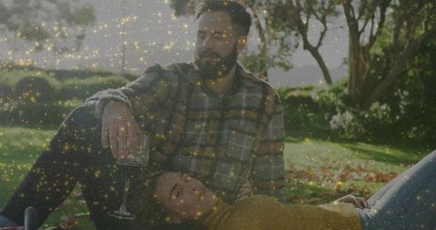 Relaxed Couple Lounging Outdoors with Wine