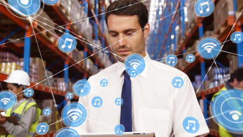 Warehouse Supervisor Using Tablet with Digital Network Overlay