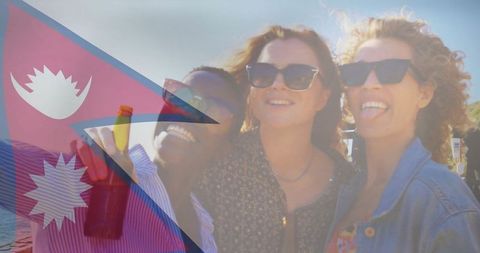 Carefree Friends Celebrating on Beach under Sun