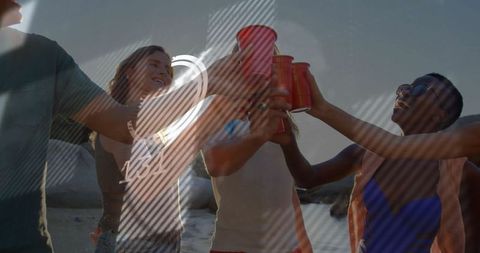 Group of Diverse Friends Celebrating on Sunset Beach