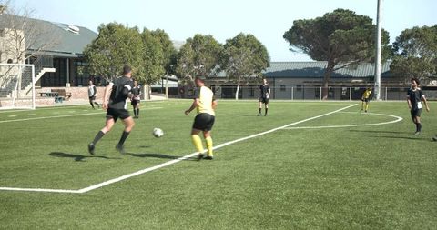 Intense soccer practice session on field with athletes