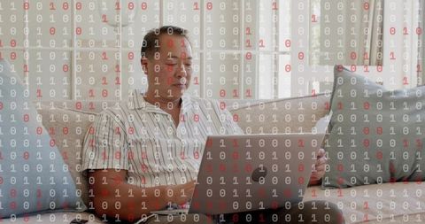 Chinese Man Working Remotely on Laptop in Minimalist Living Room with Binary Overlay