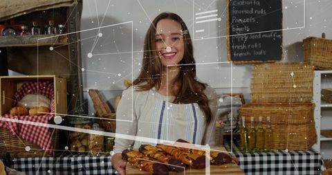 Woman presenting fresh chocolate pastries at rustic bakery stall