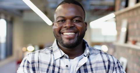 Smiling African American Businessman in Casual Office Environment - Download Free Stock Images Pikwizard.com