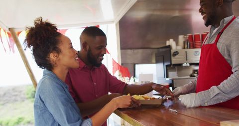Friendly Food Truck Owner Serving Happy Customers - Download Free Stock Images Pikwizard.com
