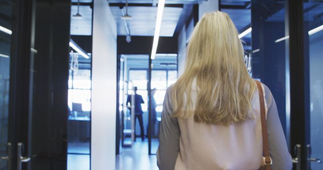 Businesswoman Walking into Modern Office Building - Download Free Stock Images Pikwizard.com