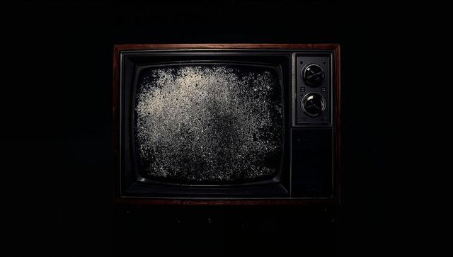Retro Static on Vintage Wooden CRT Television in Dark