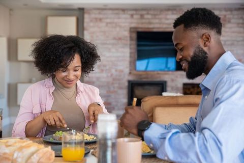 Couple Enjoying Breakfast at Home Focused on Bonding and Health