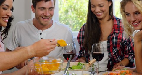 Group of Friends Enjoying Healthy Meal with Wine