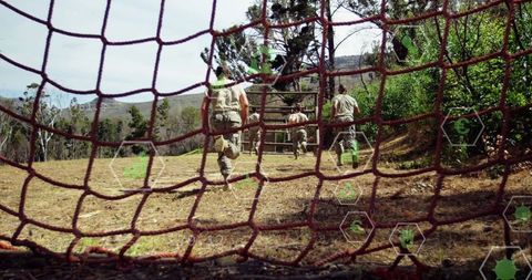 Soldiers Navigating Obstacle Course in Mountainous Terrain