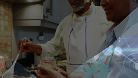 Senior African Couple Cooking Together in Kitchen