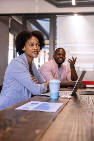 African american professionals in meeting collaborating on business strategy