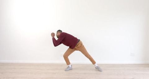 Energetic Dancing Man Expressing Freedom and Joy Indoors