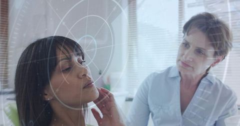 Clinician examining patient jaw with augmented reality hud overlay in modern medical clinic