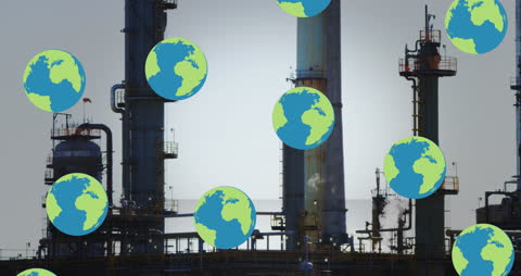 Globes Falling Over Industrial Oil Refinery at Twilight