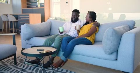 Couple Enjoying Coffee Together in Cozy Living Room