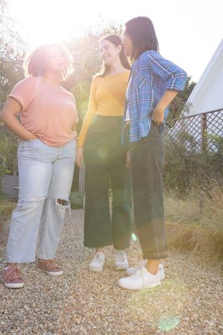 Diverse Women Enjoying Outdoor Gathering in Sunlit Garden