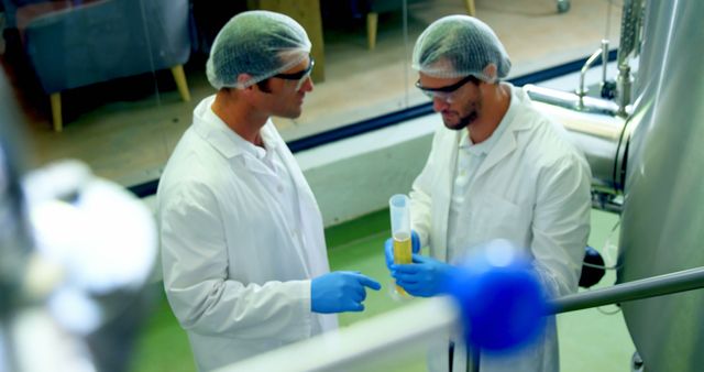 Scientists in Laboratory with Safety Gear Discussing Research - Download Free Stock Images Pikwizard.com