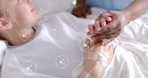 Nurse Comforting Young Patient with Technology Concept Overlay