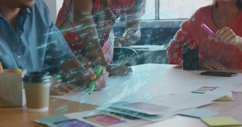 Creative Team Collaborating on Design Concepts in Modern Workspace