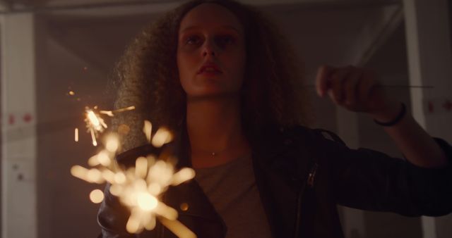 Young Caucasian Woman Celebrating with Sparklers Indoors - Download Free Stock Images Pikwizard.com