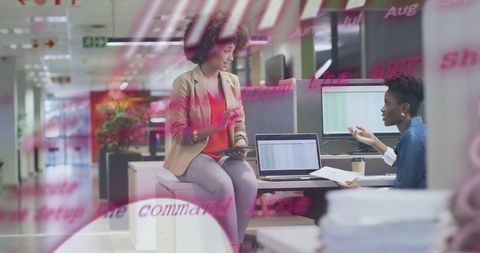 Diverse Businesswomen Collaboration with Financial Data in Modern Office