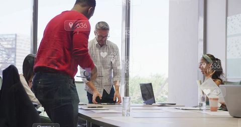 Diverse team brainstorming and reacting to alert while checking documents for pitch