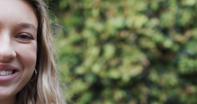 Close-Up of Smiling Woman with Plants in Background - Download Free Stock Images Pikwizard.com