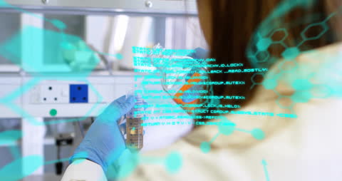 Scientist Engaged in Data and Chemical Analysis Experiment