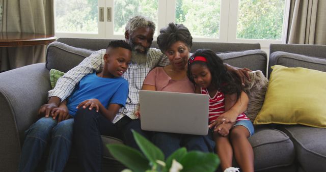 Multigenerational Family Using Laptop on Couch at Home - Download Free Stock Images Pikwizard.com