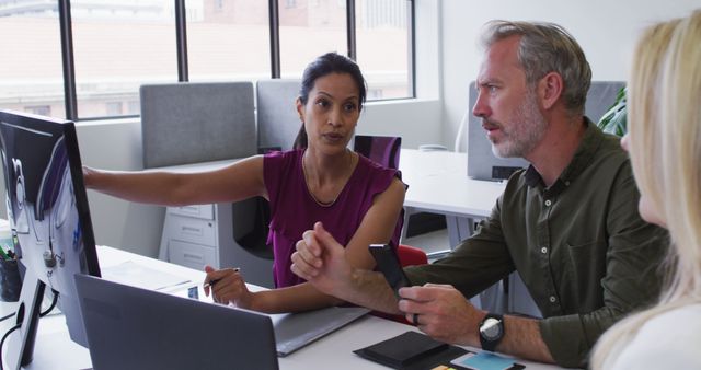 Business Team Collaborating in Office on Computer Work - Download Free Stock Photos Pikwizard.com