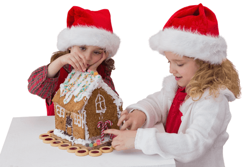 girls decorating gingerbread house with santa hats transparent - Download Free Stock Videos Pikwizard.com