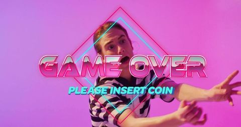 Female model reaching and extending arms in neon retro arcade game over please insert coin