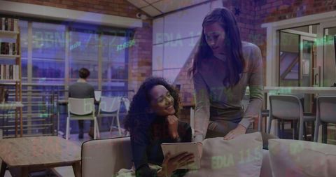 Colleagues Collaborating with Stock Market Projections in Modern Office