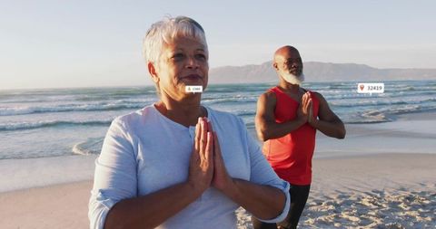 Senior Couple Practicing Yoga on Scenic Beach at Sunrise