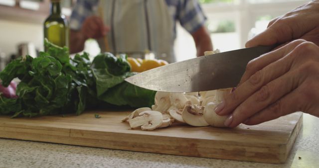 Close-Up of Chopping Mushrooms on Cutting Board in Kitchen - Download Free Stock Images Pikwizard.com