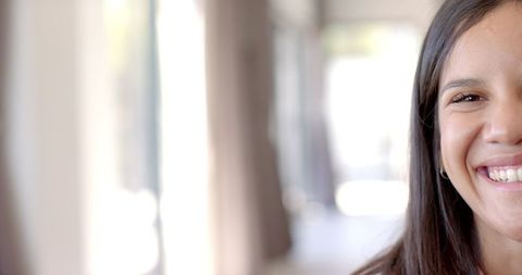 Cheerful Young Woman Smiling with Relaxed Style