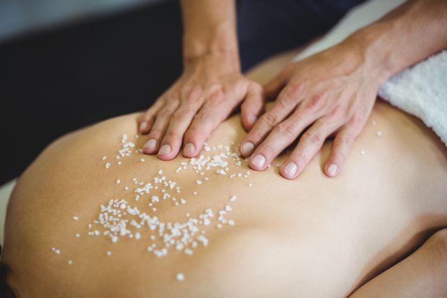 Woman receiving salt scrub therapy from physiotherapist - Download Free Stock Photos Pikwizard.com