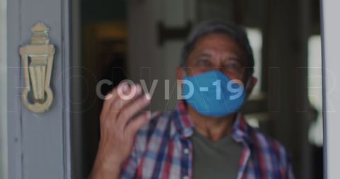 Senior Man Wearing Mask at Home During COVID-19 Pandemic