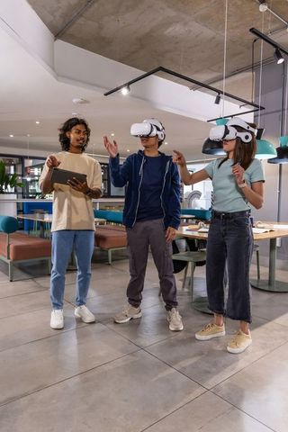 Team testing vr headsets and gesture controls in modern coworking space