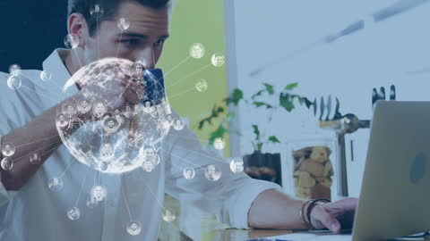Man Drinking Coffee Using Laptop With Digital Networking Concept