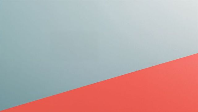 Diagonal coral and blue-gray minimalist geometric background featuring matte two-tone panels
