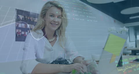 Smiling Businesswoman Enthusiastically Analyzing Financial Data in Modern Office