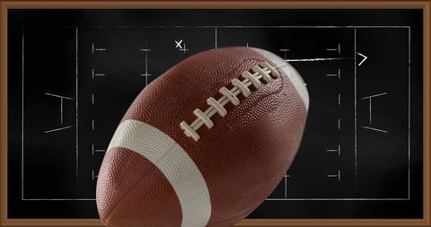 American football overlaid on game plan background