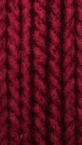 Vertical Macro Video Capturing Burgundy Plied Yarn Texture and Fuzzy Wool Fibers