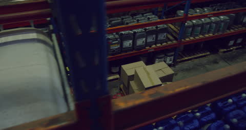 Warehouse Team Collaborating in Storage Aisle