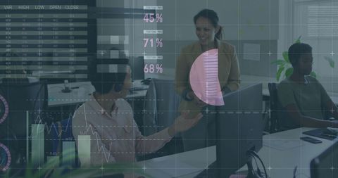 Diverse Colleagues Analyzing Financial Data in Modern Office Environment